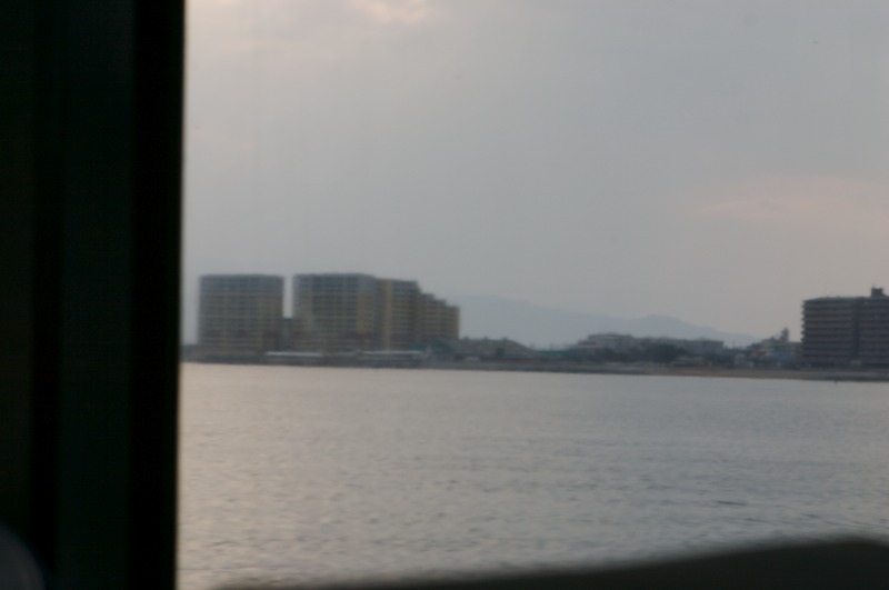 From inside the ferry, the windows have an odd coating that makes things wavy.. These are some buildings though. :D